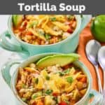 Homemade El Torito's chicken tortilla soup in two soup crocks.