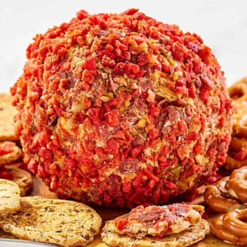 French onion cheese ball and crackers on a platter.