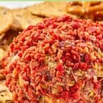 French onion cheese ball covered with bacon bits.