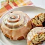 Homemade Panera cinnamon rolls with icing on a plate.
