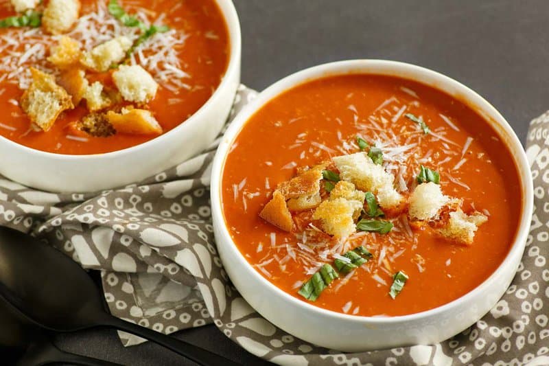 Copycat Panera tomato soup in two bowls.
