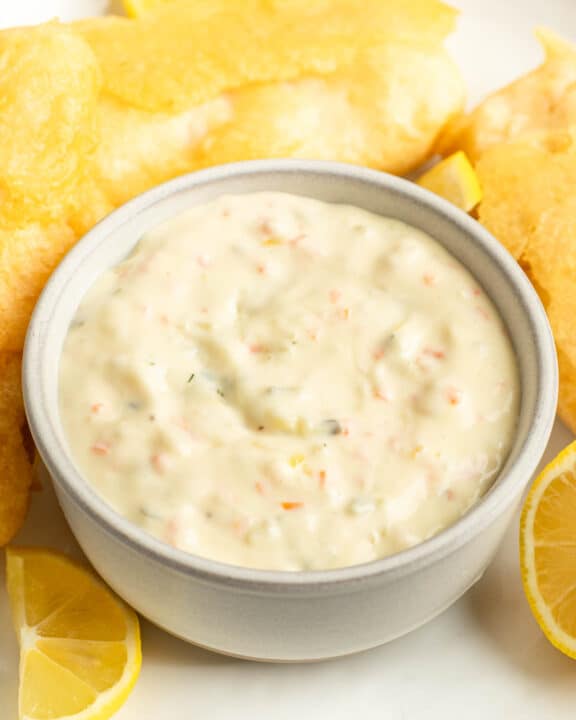 A bowl of copycat Red Lobster tartar sauce and fried fish on a plate.