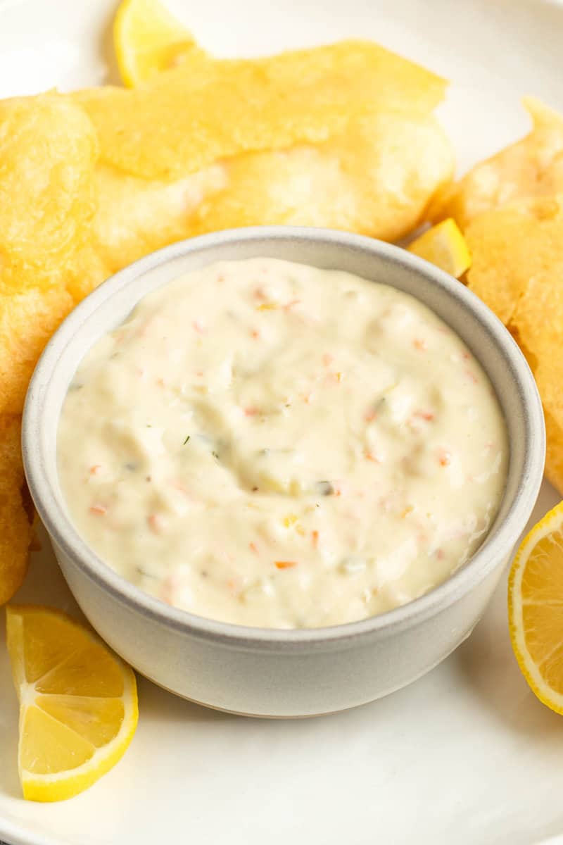 A bowl of copycat Red Lobster tartar sauce and fried fish on a plate.