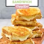 Three homemade Starbucks grilled cheese sandwiches cut in half and stacked.