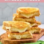 Homemade Starbucks grilled cheese sandwiches on a wood board.