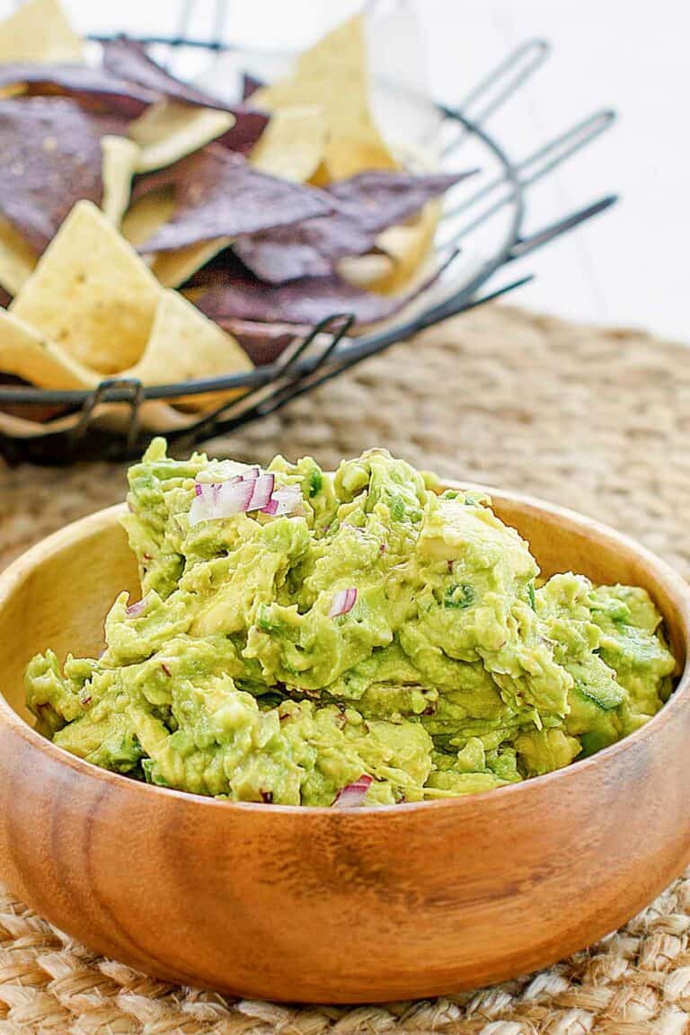 Copycat Chipotle guacamole in a wood bowl.