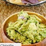 Homemade Chipotle guacamole in a wood bowl.