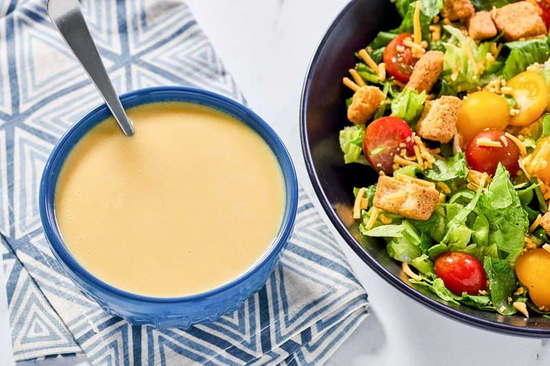 Copycat Outback Steakhouse honey mustard dressing and a salad.