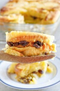Copycat Raglan Road bread pudding serving on a wooden spoon.