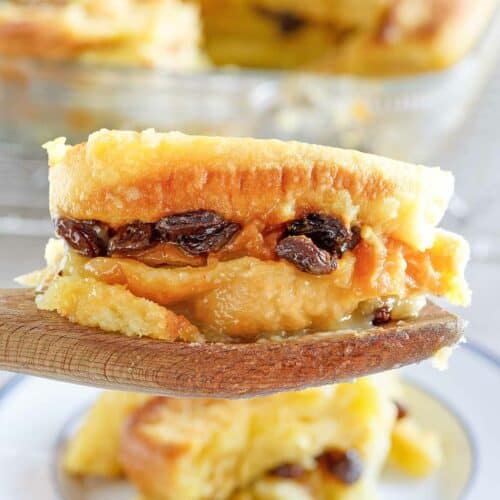 Copycat Raglan Road bread pudding serving on a wooden spoon.