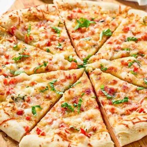 Copycat Red Lobster lobster pizza and a pizza cutter.