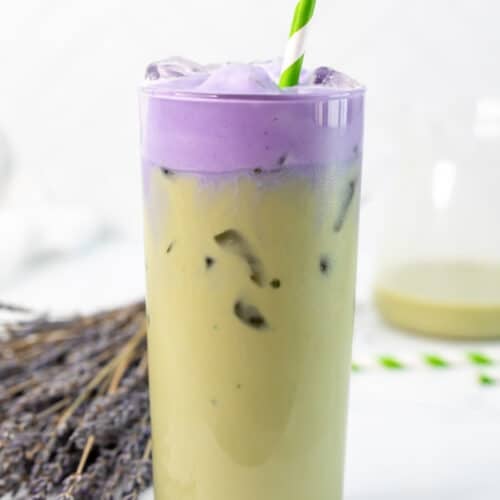 Copycat Starbucks iced lavender cream oatmilk matcha in a glass with a straw.