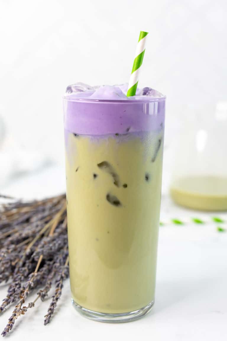Copycat Starbucks iced lavender cream oatmilk matcha in a glass with a straw.