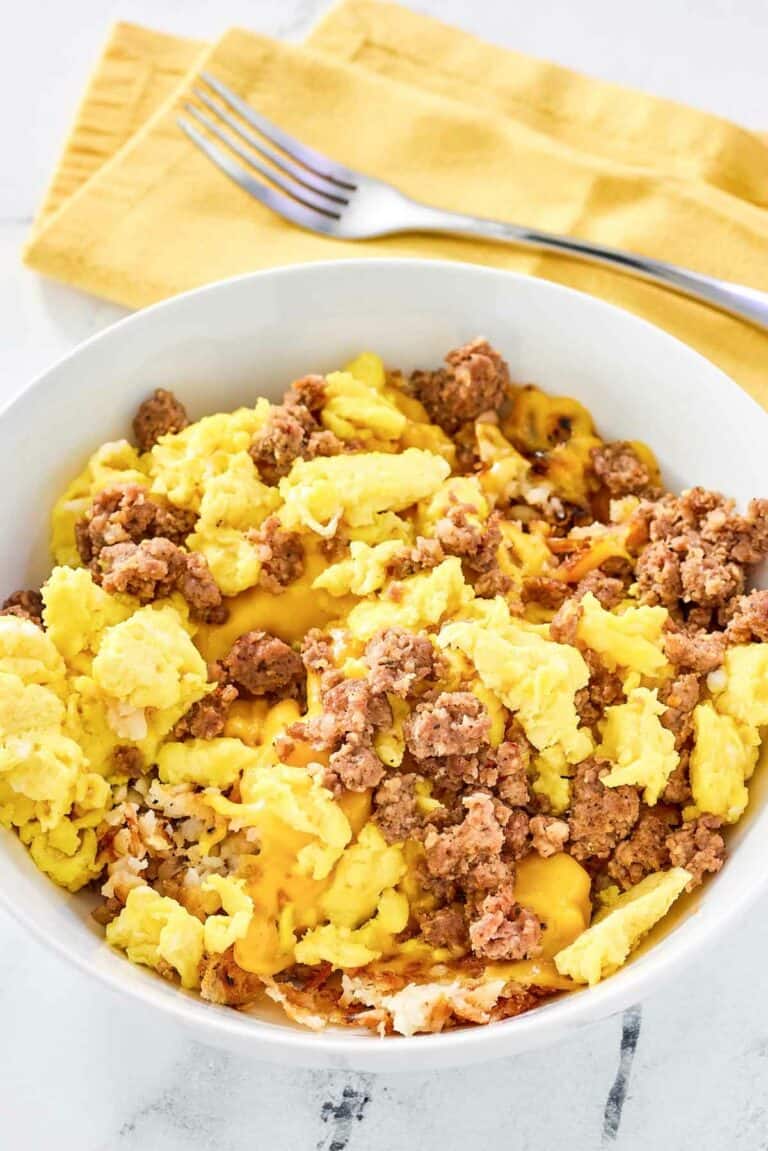 Copycat Waffle House sausage, egg, and cheese hashbrown bowl.