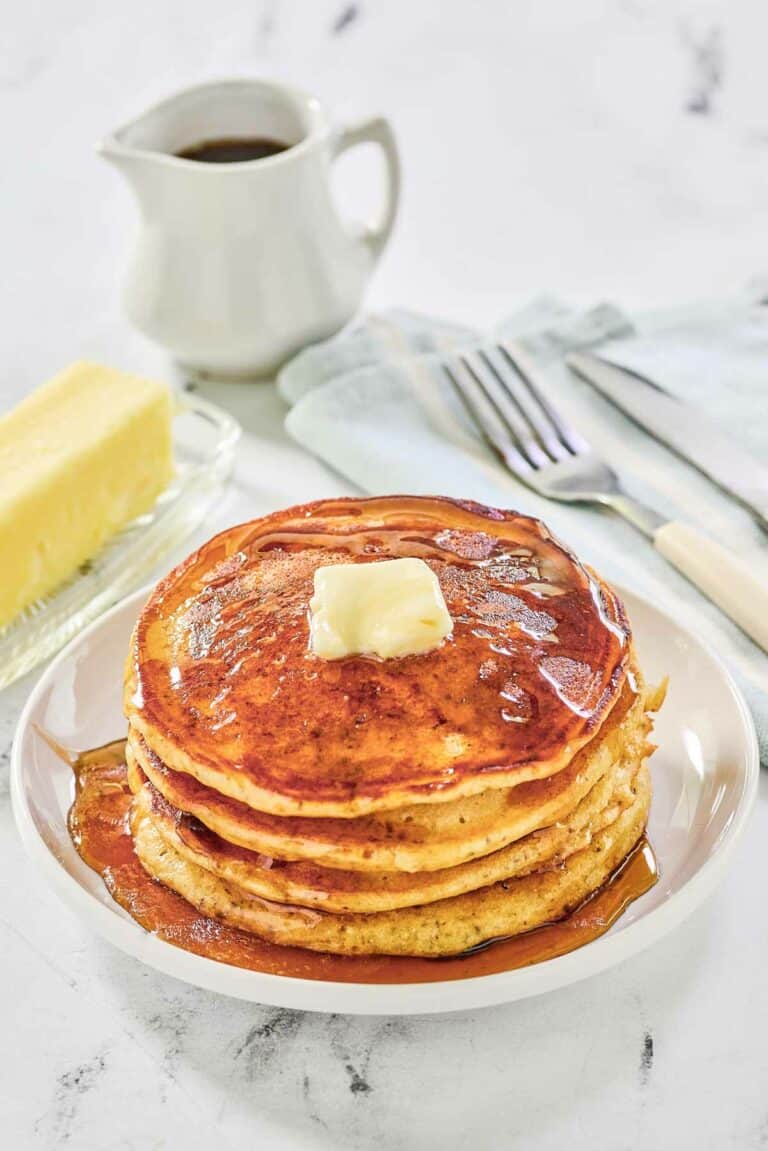 Copycat IHOP protein pancakes topped with butter and syrup.
