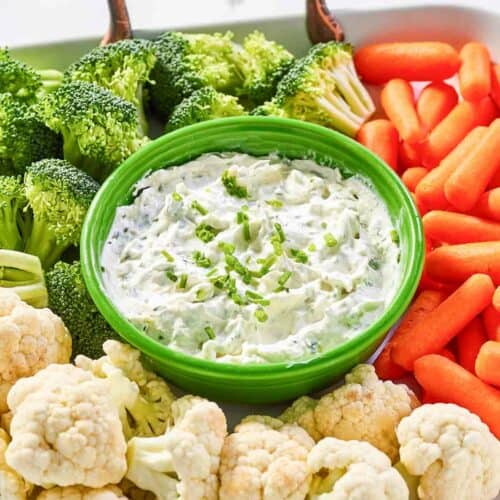 Copycat Melting Pot green goddess dip and fresh vegetables on a tray.