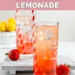 Two glasses of homemade Sonic strawberry lemonade, strawberries, and lemons.