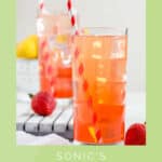 Copycat Sonic strawberry lemonade in two glasses and fresh strawberries next to them.