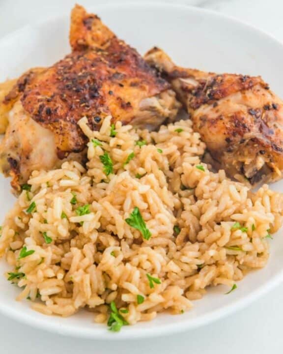 Copycat Texas Roadhouse rice and chicken on a plate.