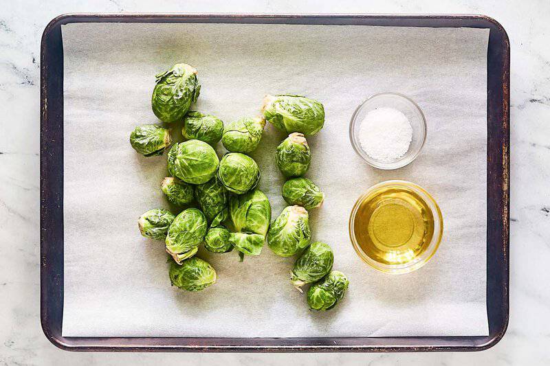 Air fryer Brussels sprouts ingredients on a tray.