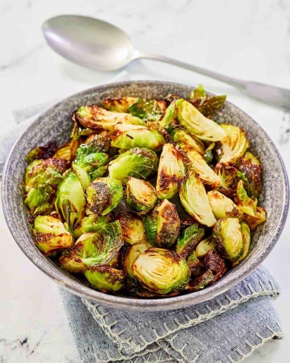 Air fryer Brussels sprouts in a bowl.