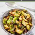 Air fryer Brussels sprouts in a serving bowl on top of a cloth napkin.