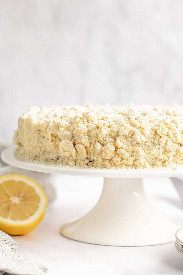 Copycat Olive Garden lemon cream cake on a cake stand.