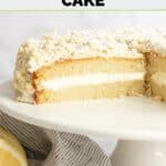 A portion of homemade Olive Garden lemon cream cake on a cake stand.