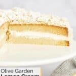 Homemade Olive Garden lemon cream cake on a cake stand.
