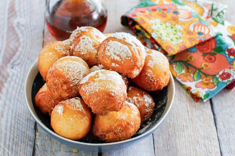 Copycat Denny's pancake puppies, syrup, and a cloth napkin.