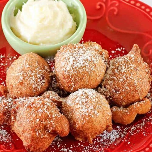 Copycat Denny's strawberry pancake puppies and a small bowl of cheesecake dip.