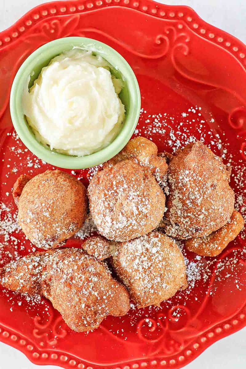 Copycat Denny's strawberry pancake puppies and cheesecake dip on a plate.
