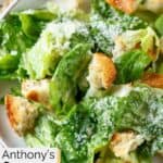 Homemade Anthony's Caesar salad with croutons on a plate.