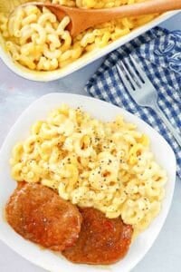 Copycat Boston Market mac and cheese in a baking dish and on a plate.