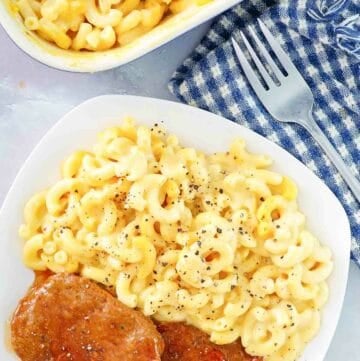 Copycat Boston Market mac and cheese in a baking dish and on a plate.