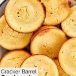 Homemade Cracker Barrel cornbread muffins piled on a plate.