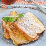 Homemade Denny's French toast topped with powdered sugar.