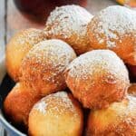 Homemade Denny's pancake puppies with powdered sugar topping.