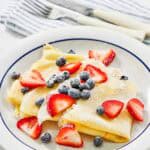 Copycat IHOP caller  berry crepes connected  a plate.