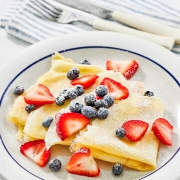 Copycat IHOP fresh berry crepes on a plate.