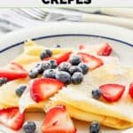 Homemade IHOP crepes with fresh blueberries and strawberries on top.