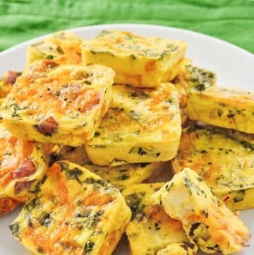 Copycat Starbucks potato cheddar and chive bakes piled on a platter.