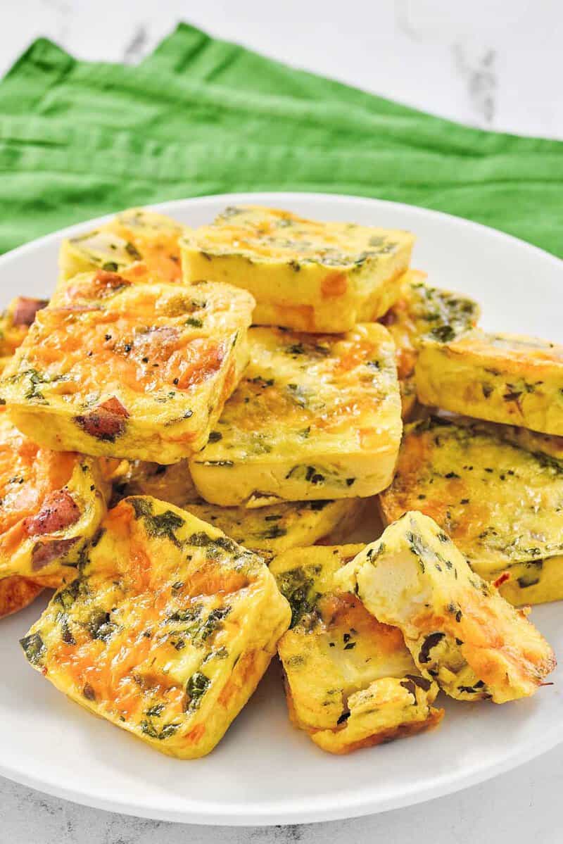 Copycat Starbucks potato cheddar and chive bakes piled on a platter.