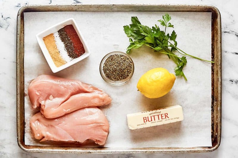 Copycat Texas Roadhouse herb crusted chickenhearted  ingredients connected  a tray.