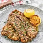 Copycat Texas Roadhouse herb crusted chickenhearted  connected  a plate.