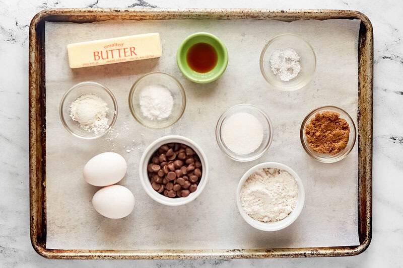 Copycat Crumble chocolate chip cookies ingredients on a tray.