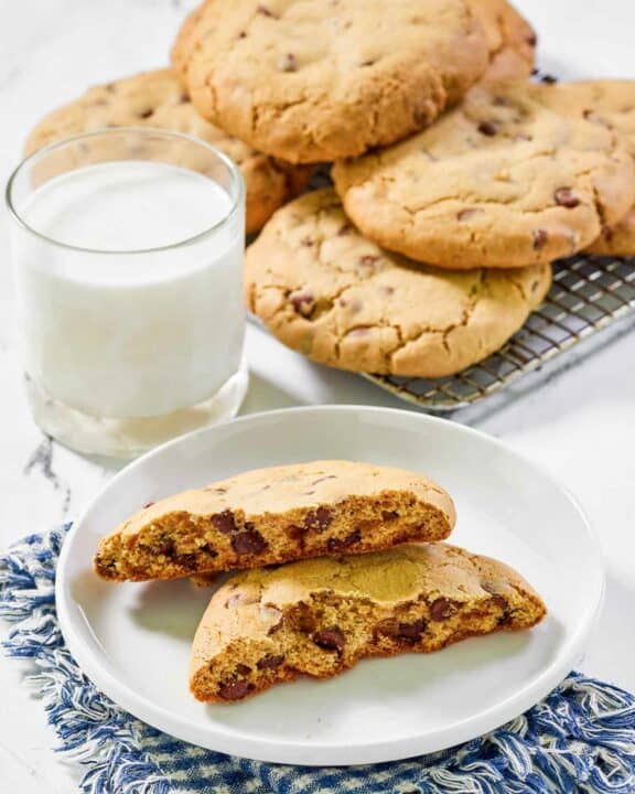 Copycat Crumble chocolate chip cookies and a glass of milk.