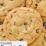 Homemade Crumbl chocolate chip cookies on a wire rack.