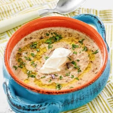 Copycat Longhorn Steakhouse mushroom bisque topped with a dollop of sour cream.