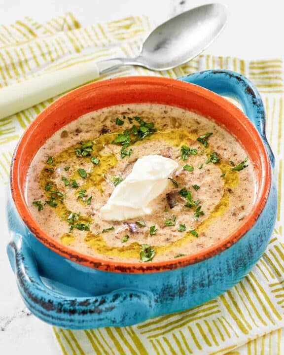 Copycat Longhorn Steakhouse mushroom bisque topped with a dollop of sour cream.